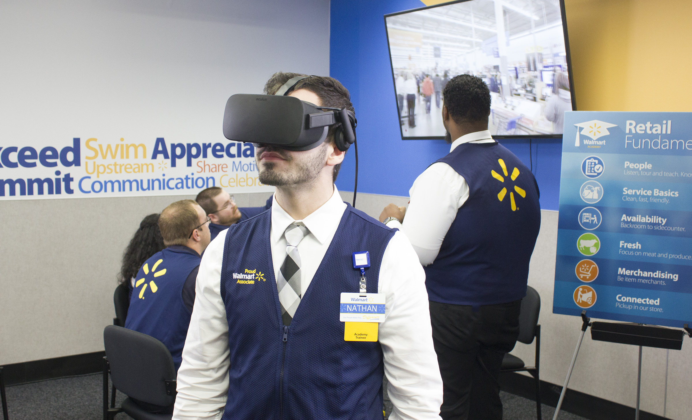 New WalMart employee completing orientation using a virtual reality headset